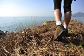 Hiker on bluffs overlooking the ocean